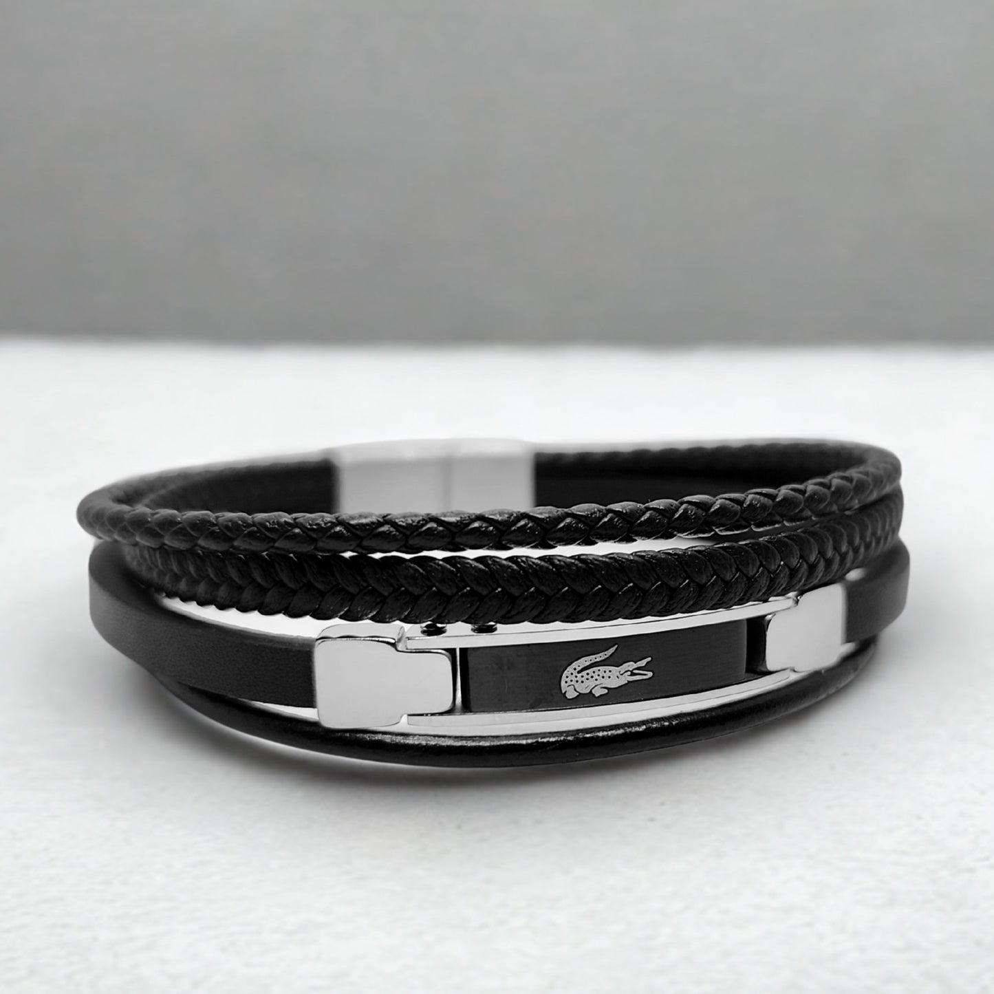 Premium Black Leather B-152 Bracelet from Overpowered Accessories featuring braided and smooth leather with a metallic clasp.
