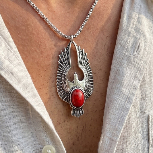 Eagle pendant necklace with red oval stone center and silver-tone textured wings