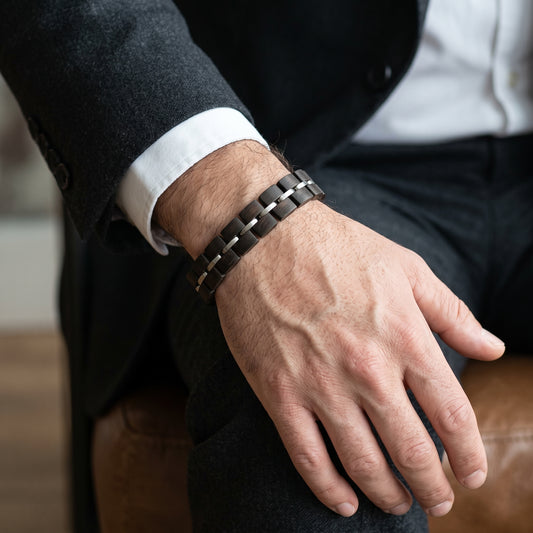 Men's dark wood bracelet with silver metal links on wrist