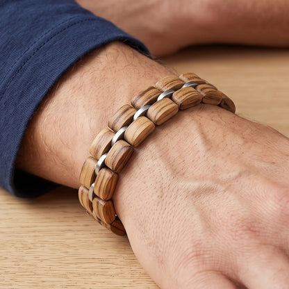 Zebrawood bracelet on wrist with alternating light wood and silver links, Overpowered Accessories