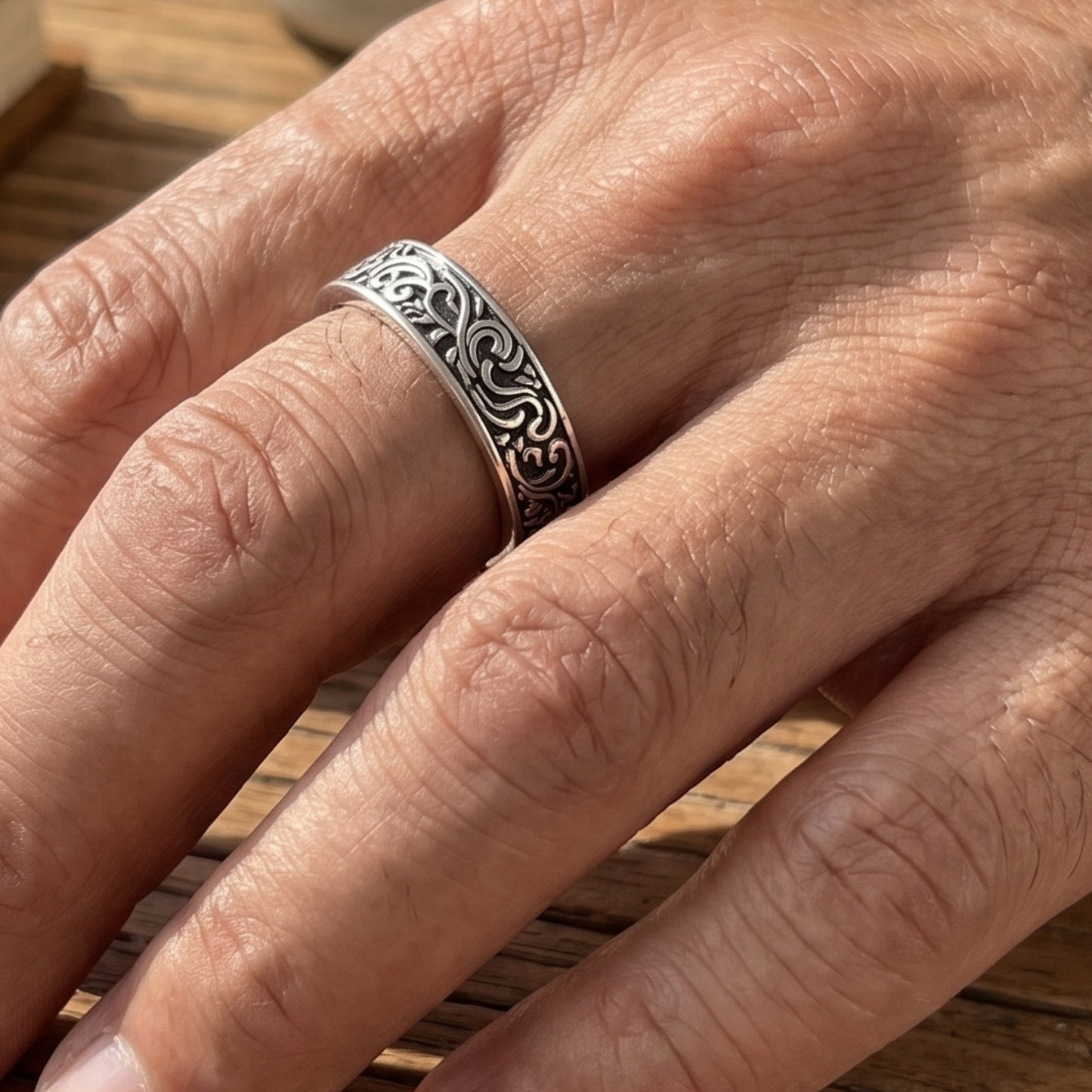 Men's silver scroll ring with engraved swirl pattern