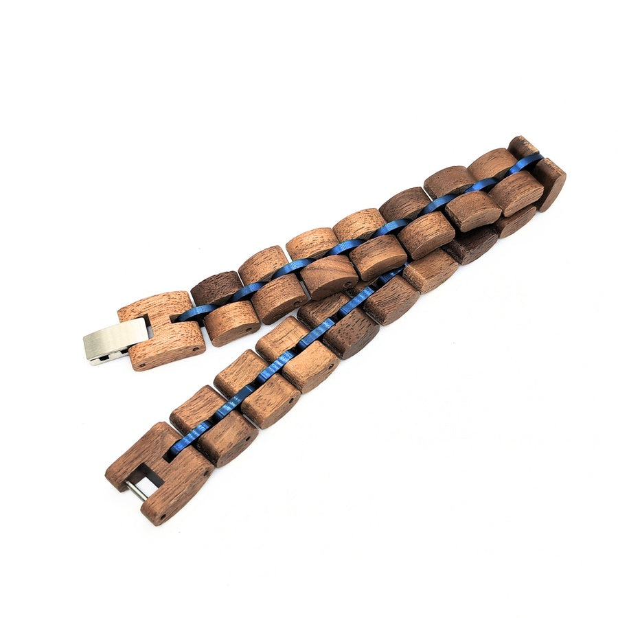 Walnut Wood B-49 Wooden Bracelet by Overpowered Accessories features interlocking wooden links with a blue accent and a metal