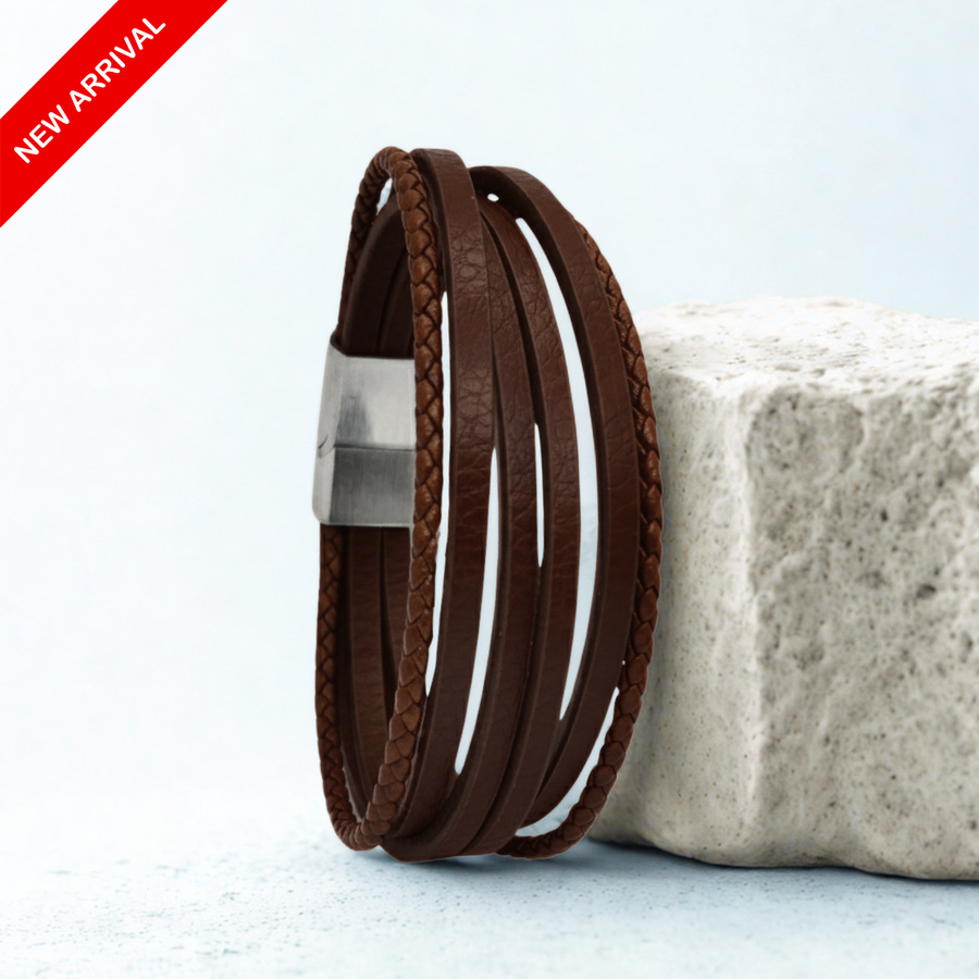 Premium Brown Leather B-107 men's bracelet featuring multiple strands and a sleek metal clasp, displayed on a textured surfac