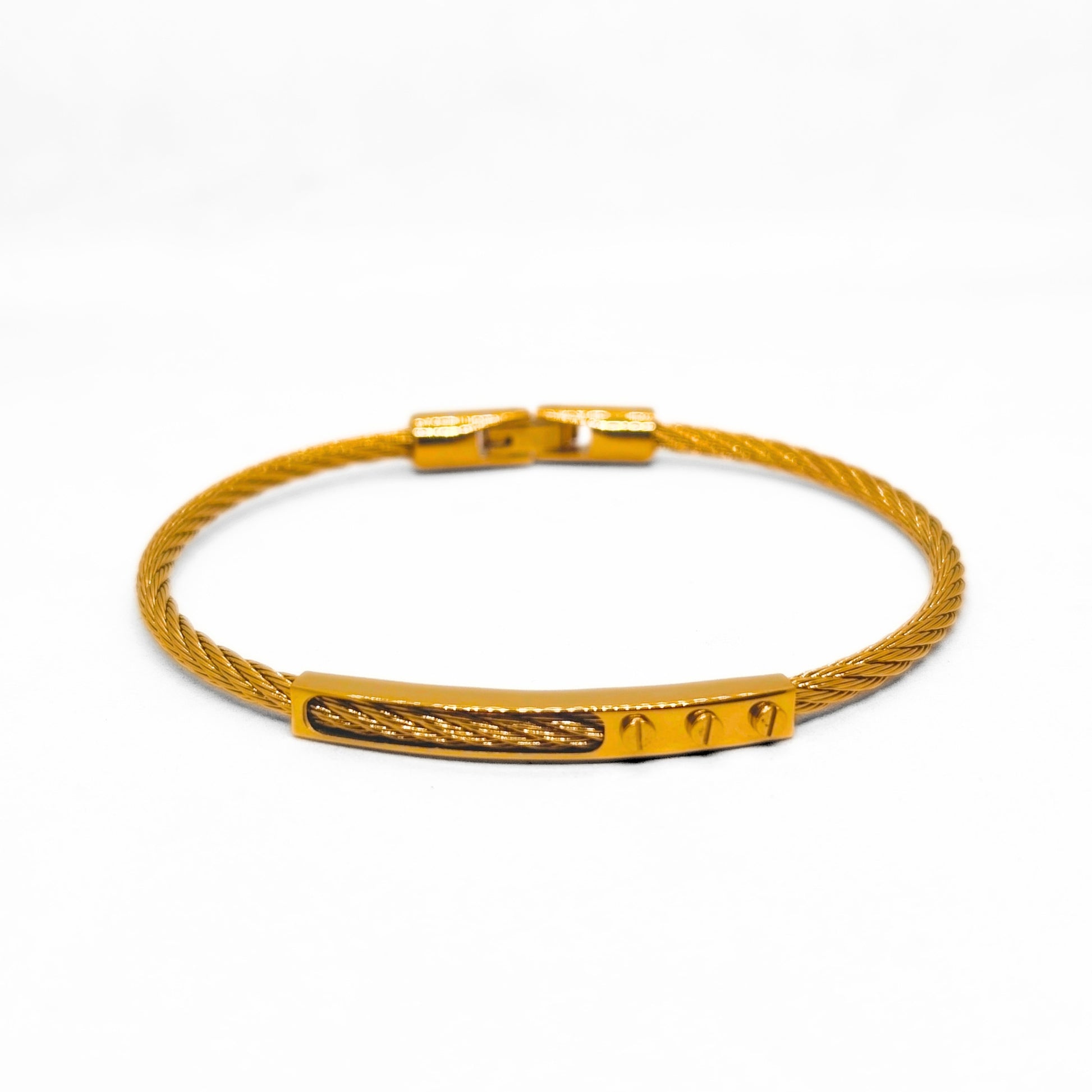 Gold bracelet with a textured band on a white background