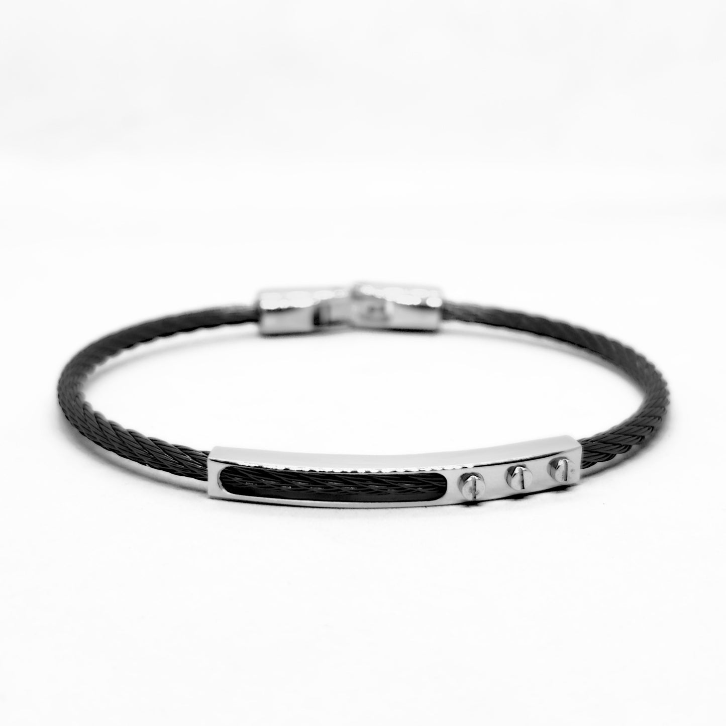 Black braided bracelet with silver clasp on a white background