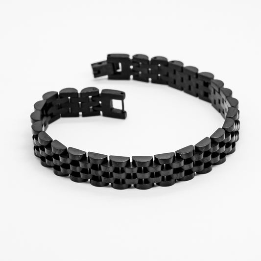 Men's stainless steel bracelet from Overpowered Accessories, featuring a sleek black design with interlocking links.