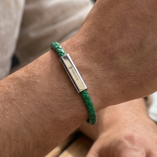 Green braided leather bracelet with rectangular silver bar clasp on wrist