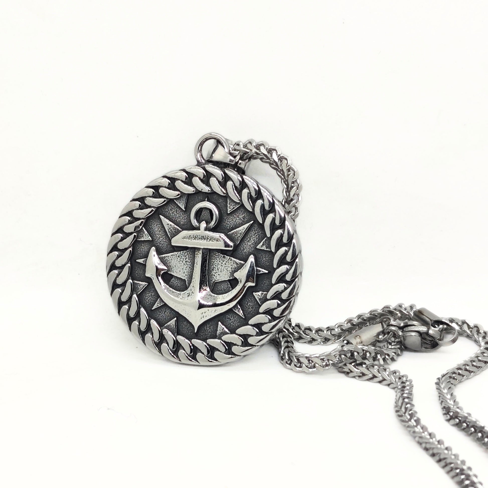 Silver steel anchor pendant necklace with a braided edge design, featuring a prominent anchor symbol.