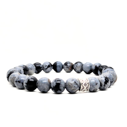 Men's gray obsidian bead bracelet with black speckle stones and a silver geometric centerpiece