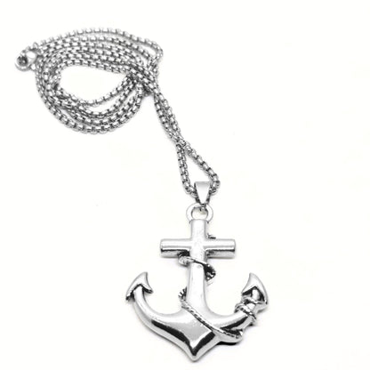 Silver anchor pendant necklace with a cross and rope detail, hanging from a metal chain. Ideal for men's fashion.