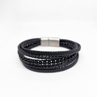 Premium Black Leather Sleek Men's Bracelet by Overpowered Accessories featuring braided leather and bead accents.