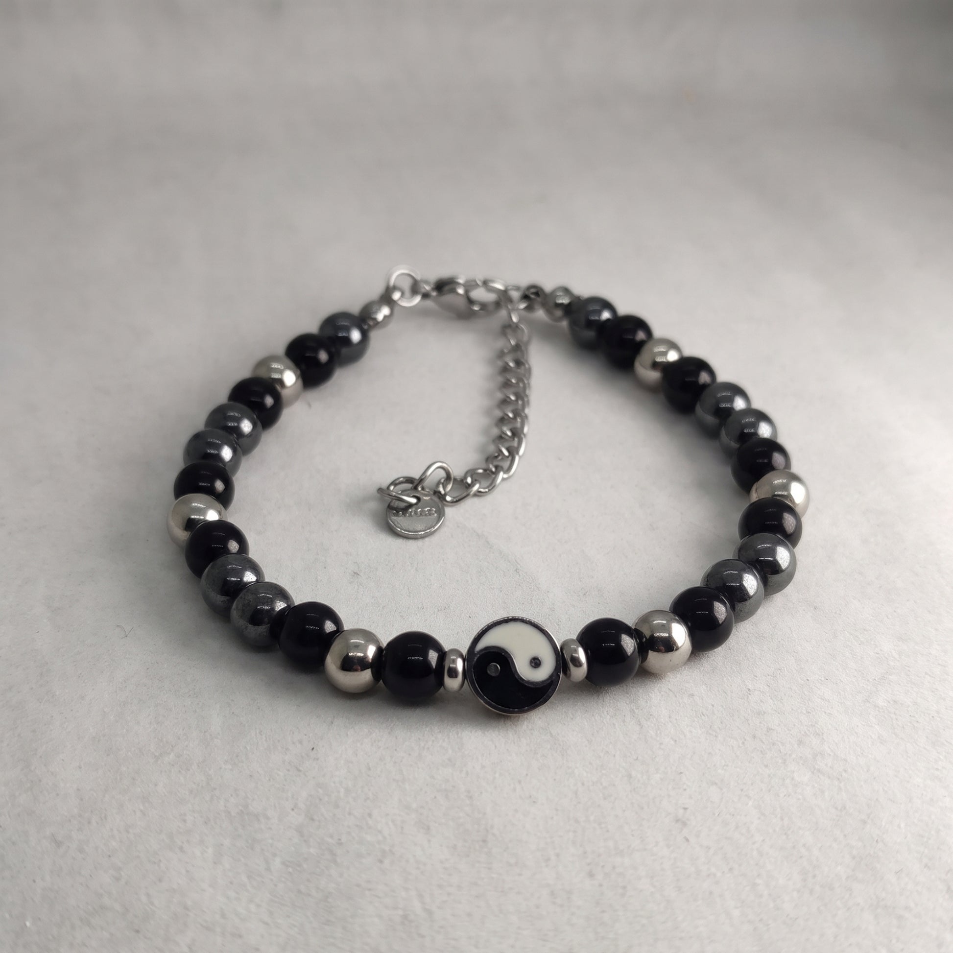 Black & silver bead yin-yang bracelet with round charm and silver chain extender