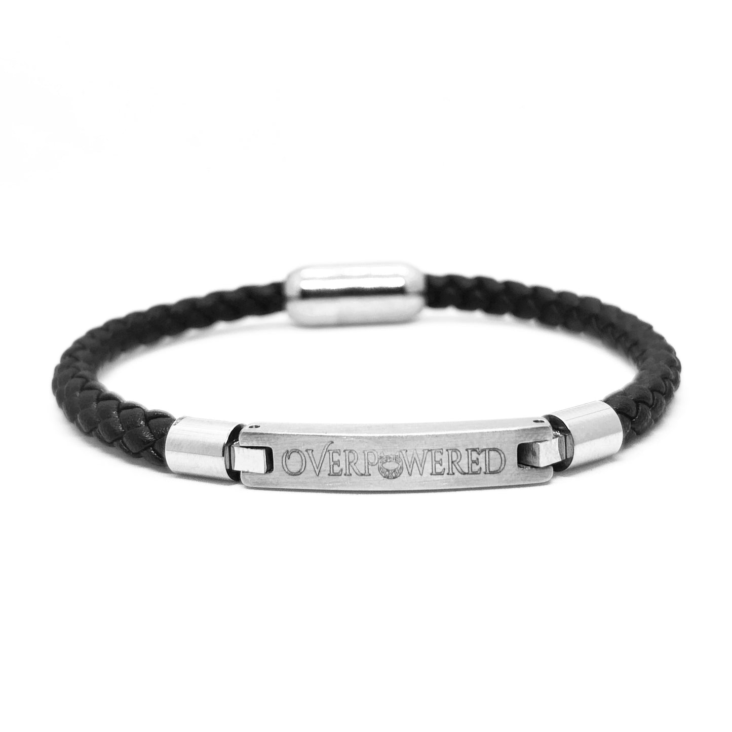 A black braided leather bracelet with a polished silver-tone metal ID bar engraved with the word 'OVERPOWERED', shown on a clean white background.