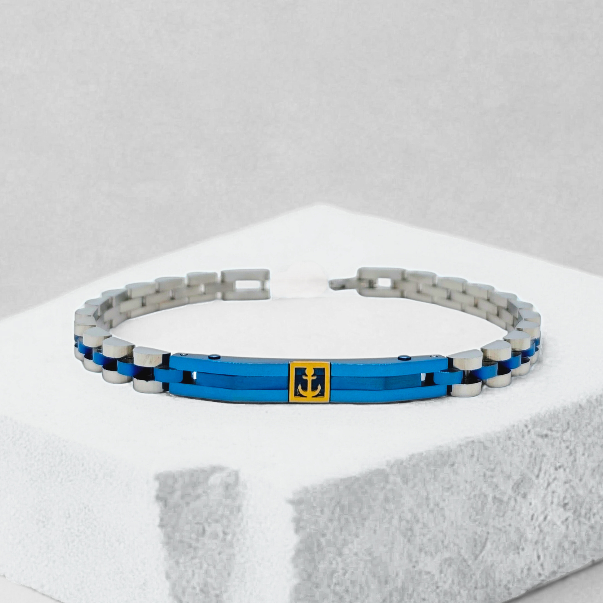 Blue and silver stainless steel men's bracelet featuring an anchor design, from Overpowered Accessories.