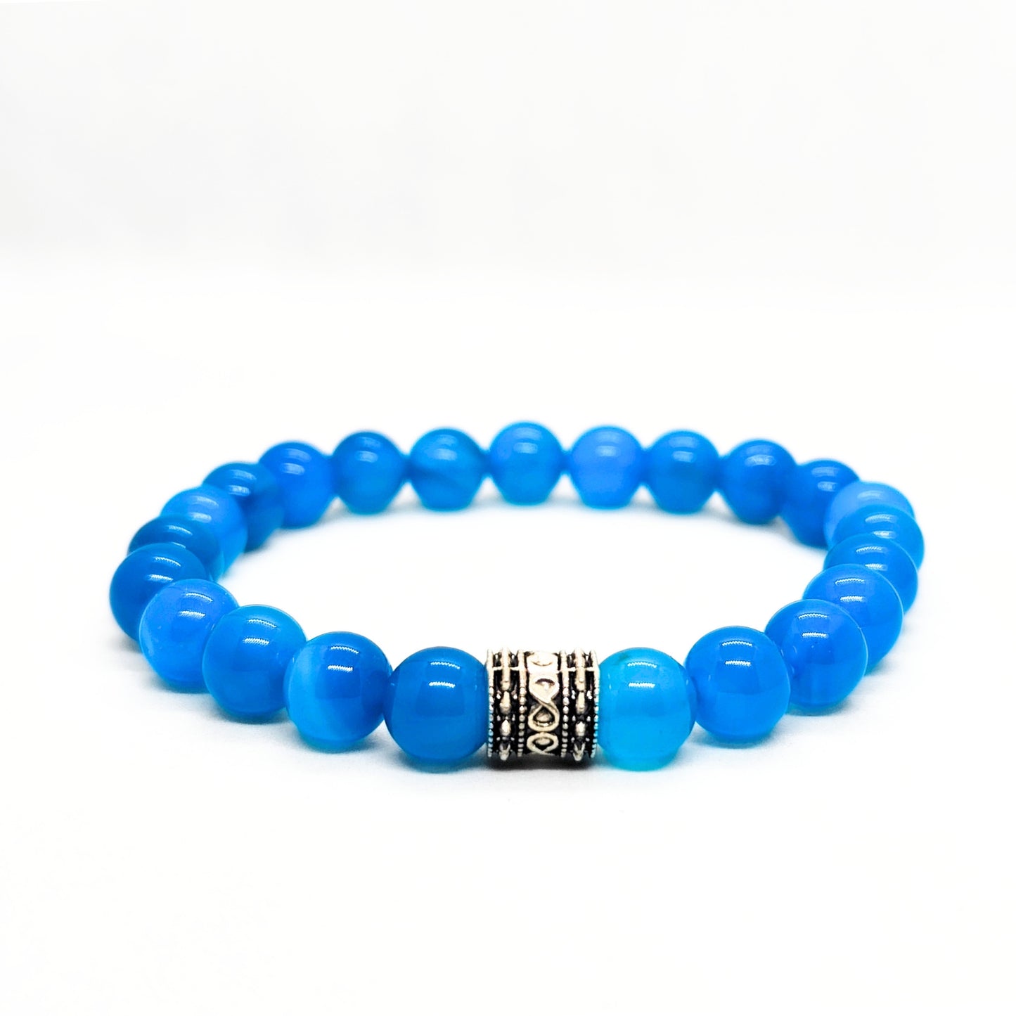Blue agate bead bracelet with dark patterned metal spacer in the center.