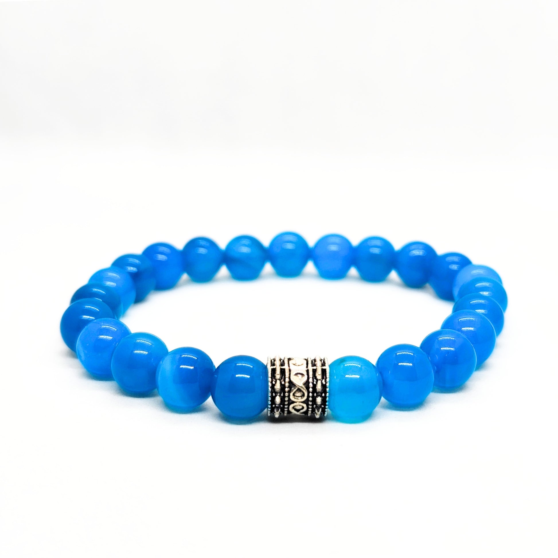 Blue agate bead bracelet with dark patterned metal spacer in the center.
