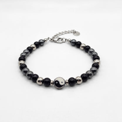 Black & silver beaded bracelet with yin-yang center charm and silver clasp