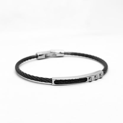 Black braided bracelet with silver clasp on a white background