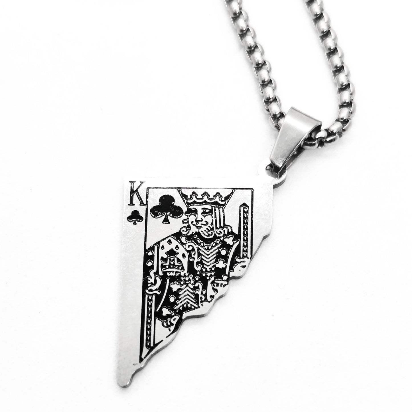 Silver King Card Pendant necklace with spade design, attached to a metal chain, by Overpowered Accessories.