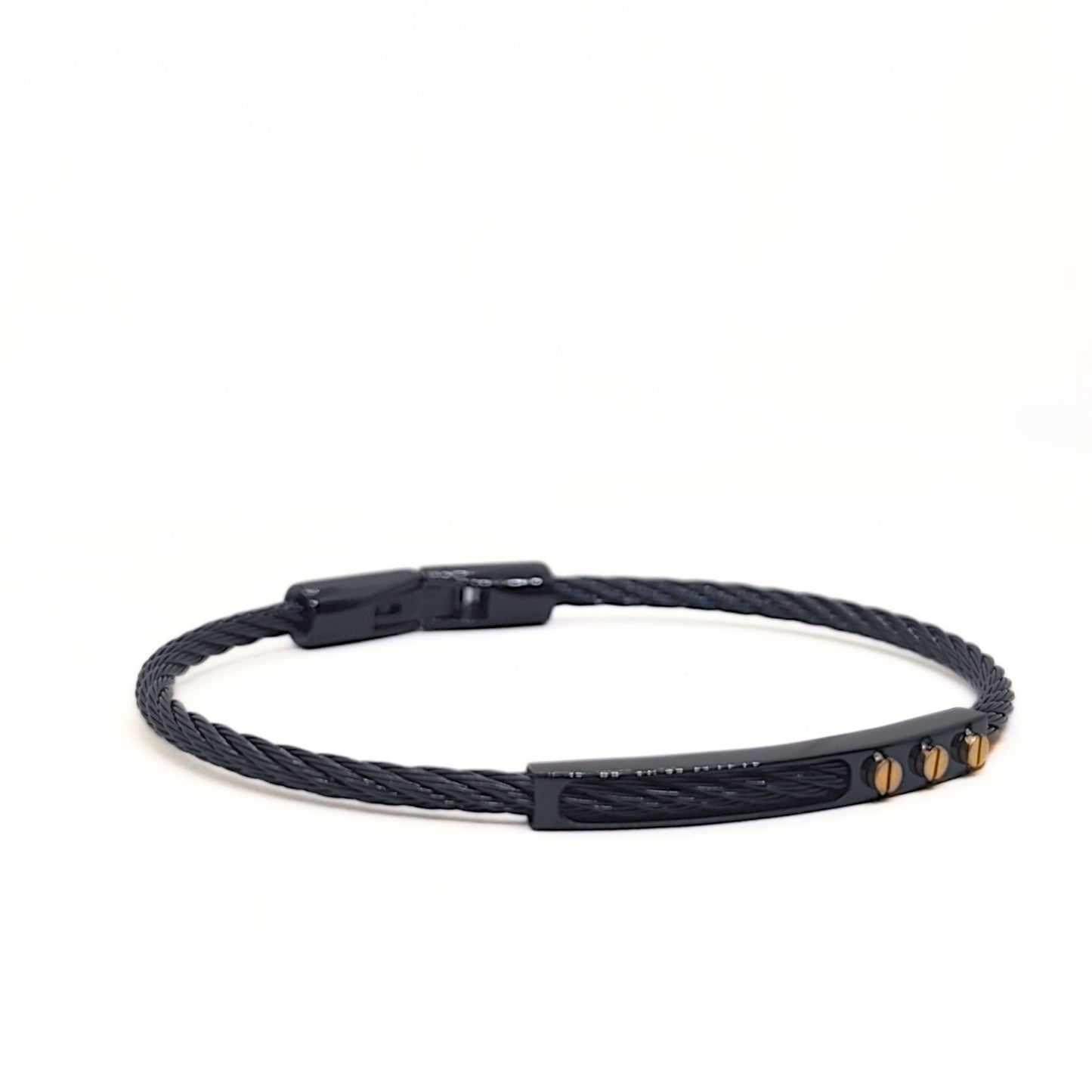 Black braided bracelet with gold accents on a white background