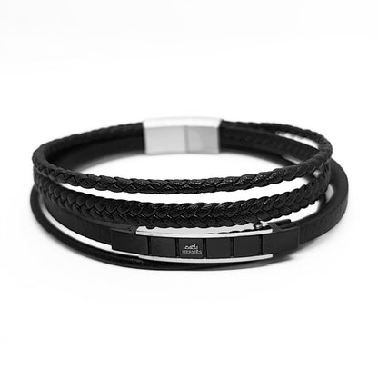Black leather bracelet set with braided top, stacked bands, and metal clasp plate