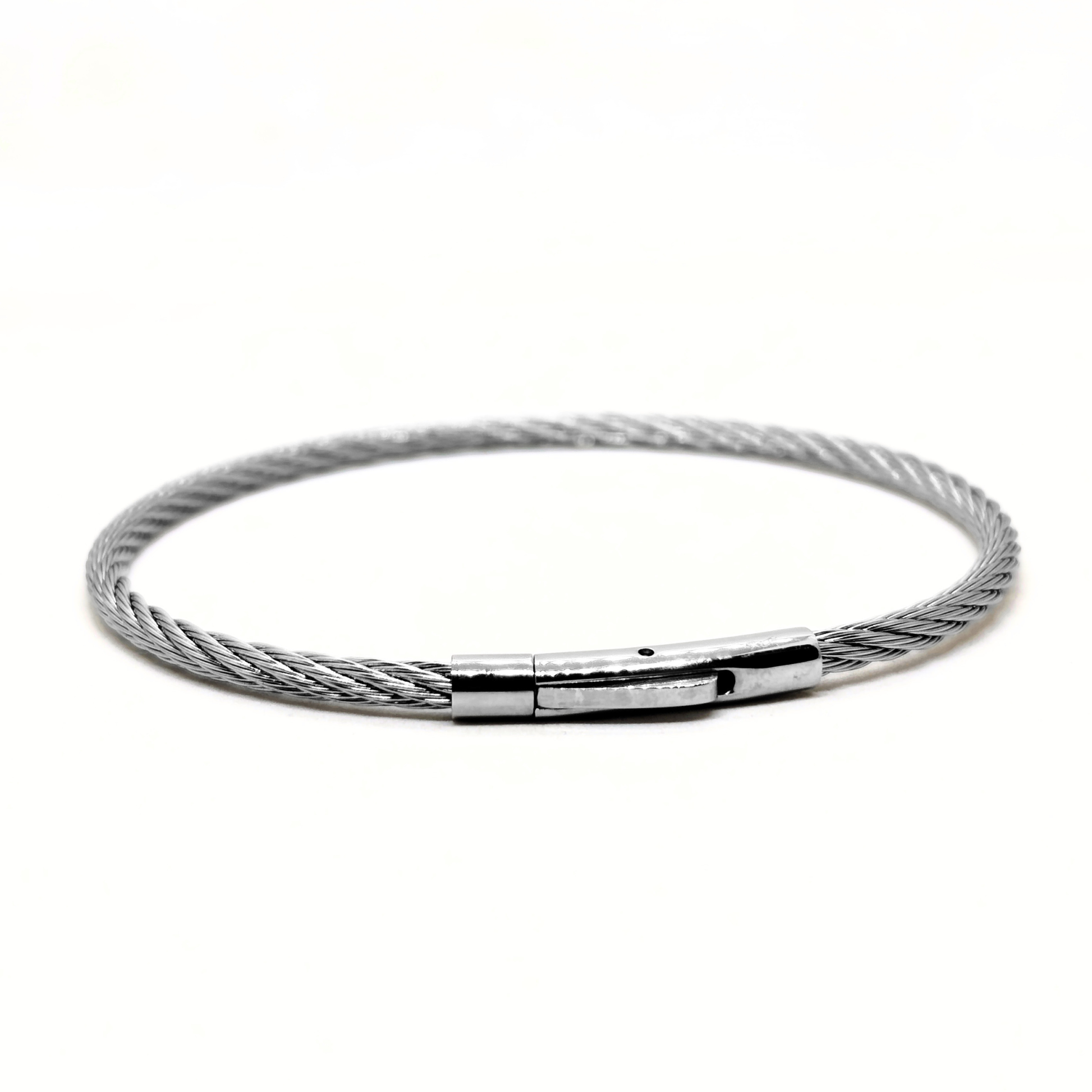 Silver stainless steel bracelet with a magnetic clasp, featuring a twisted cable design. Model B-146 by Overpowered Accessori