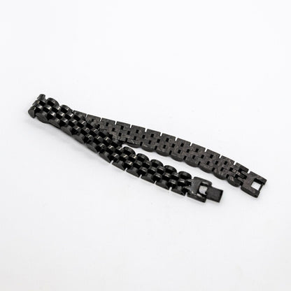 Sleek Black Stainless Steel B-16 Bracelet by Overpowered Accessories, featuring a modern interlocking design.