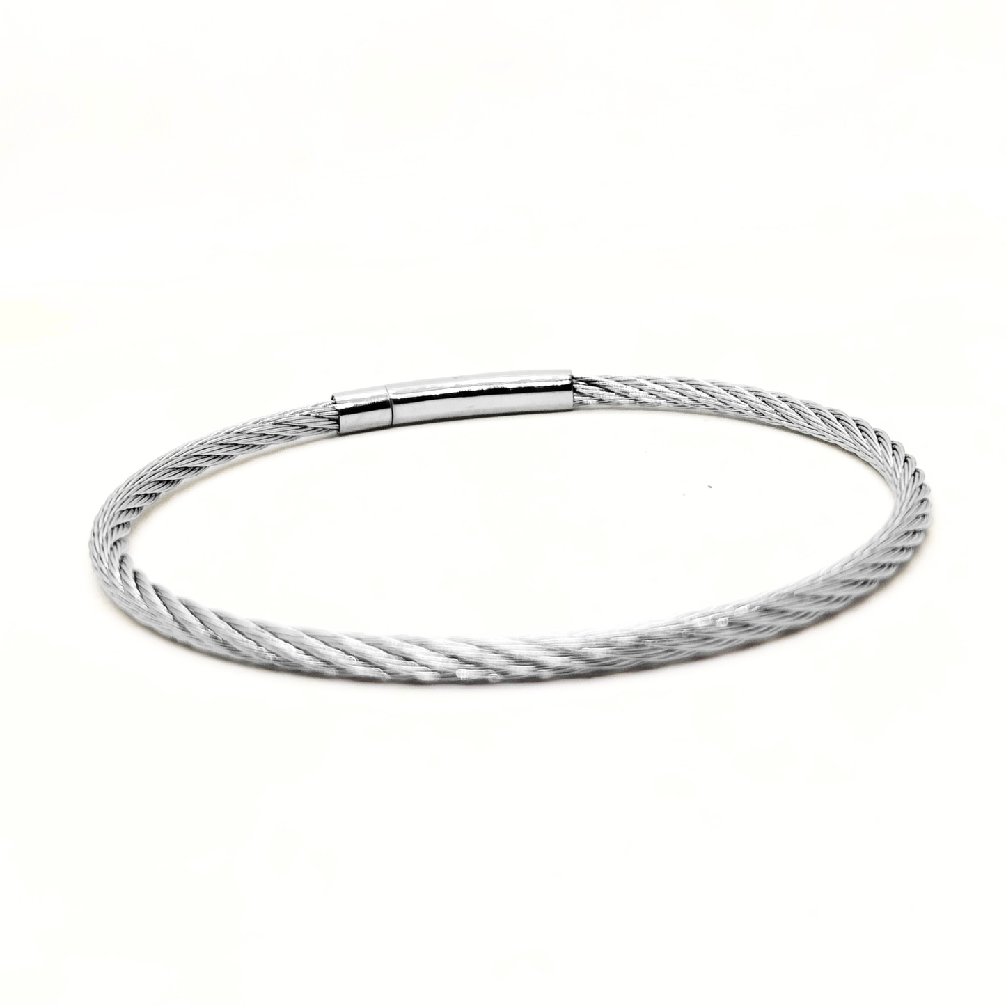 Silver stainless steel bracelet with a magnetic clasp, featuring a sleek twisted cable design. Ideal for men.