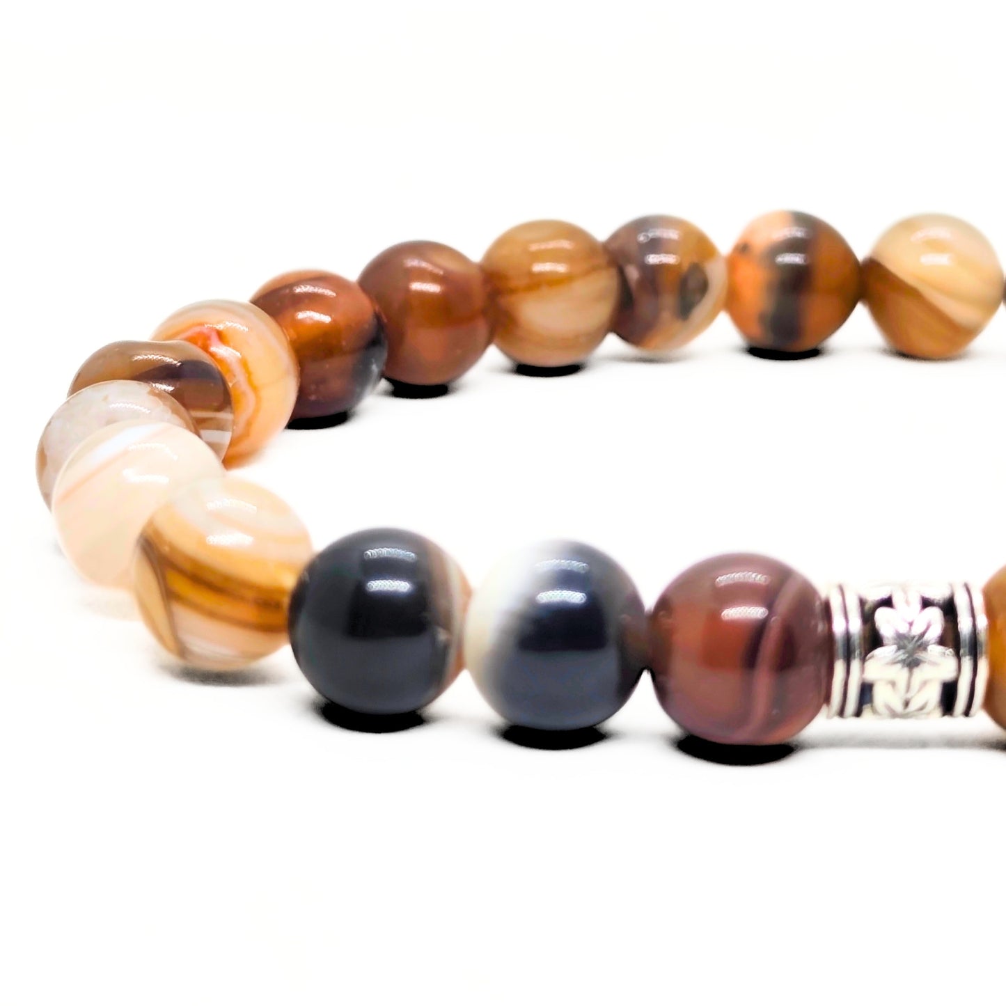 Agate bead bracelet with silver-tone centerpiece and brown, black, and white beads