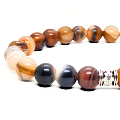Agate bead bracelet with silver-tone centerpiece and brown, black, and white beads