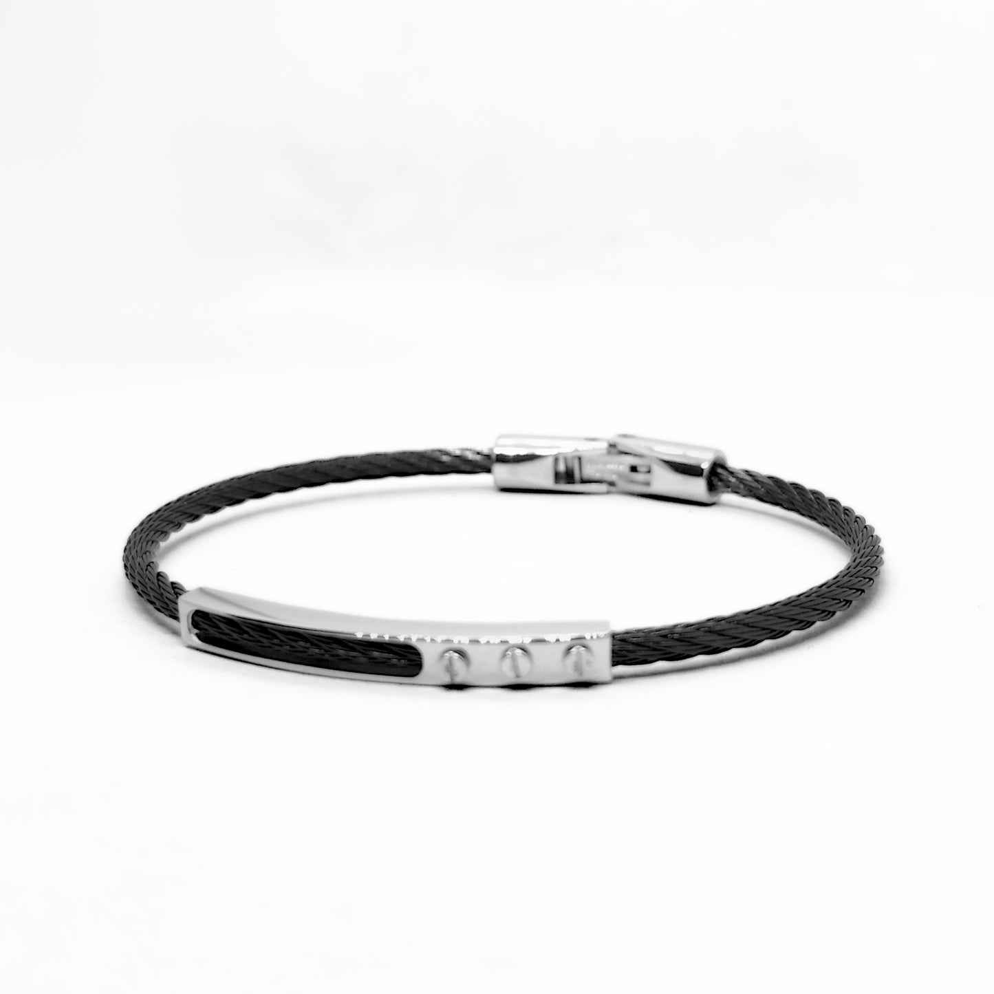 Black braided bracelet with silver clasp on a white background