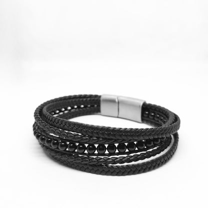 Premium Black Leather Sleek Men's Bracelet by Overpowered Accessories featuring braided leather and black beads.
