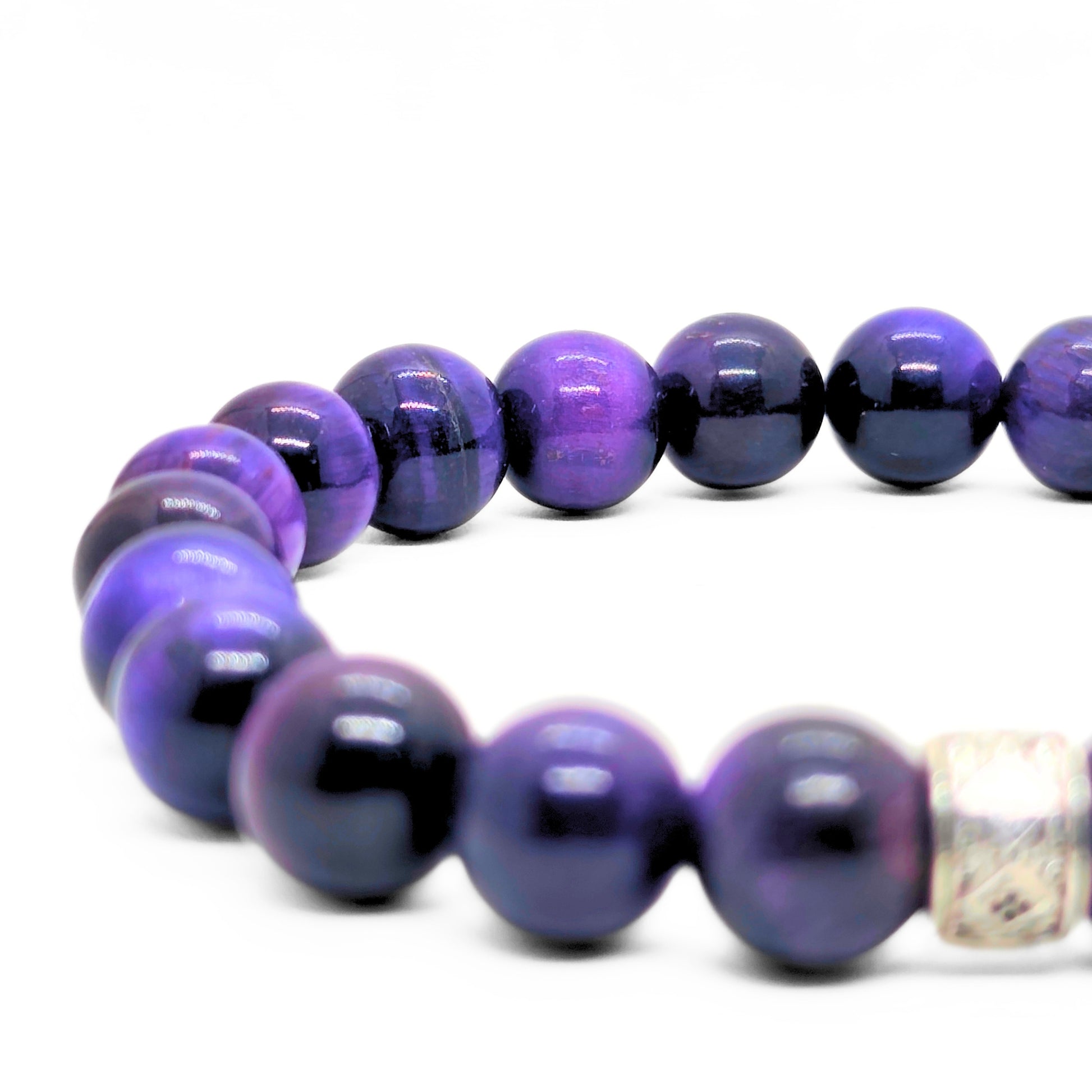Close-up of purple and black tiger's eye bead bracelet with silver-tone cube clasp