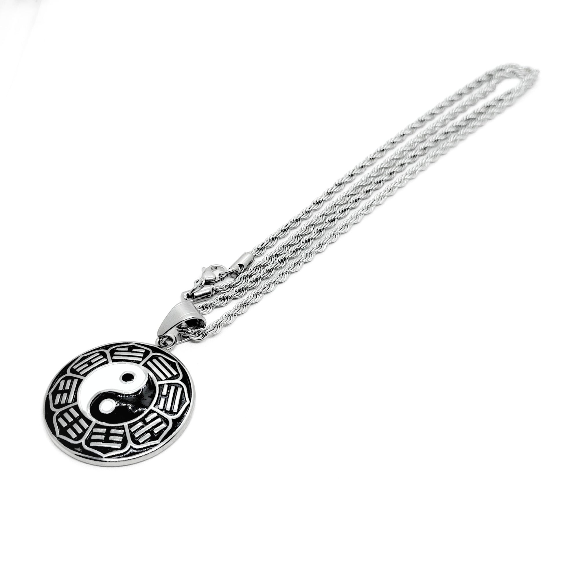 Yin-yang pendant necklace with round black-and-white enamel pendant on silver chain