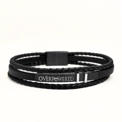 Black leather braided wrap bracelet with black clasp and engraved OVERPOWERED logo plate
