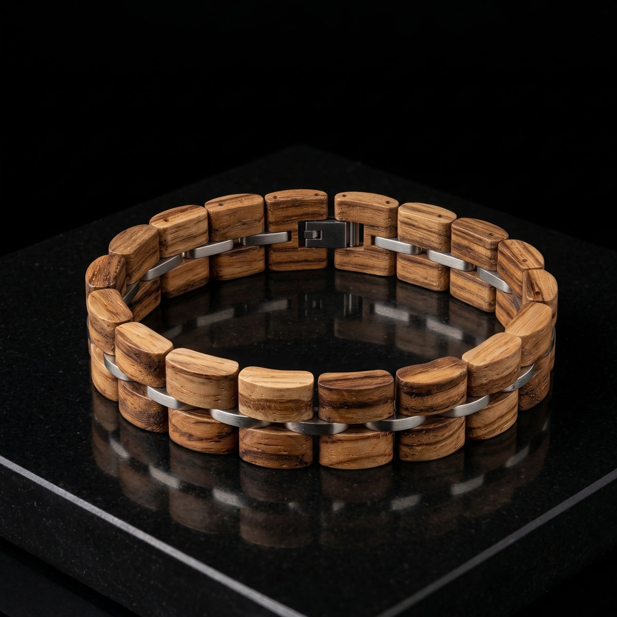 Zebrawood bracelet laid flat with silver metal bar accents, Overpowered Accessories
