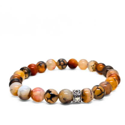 Natural agate stone bracelet with mixed orange, black, tan, and white beads and a silver patterned spacer