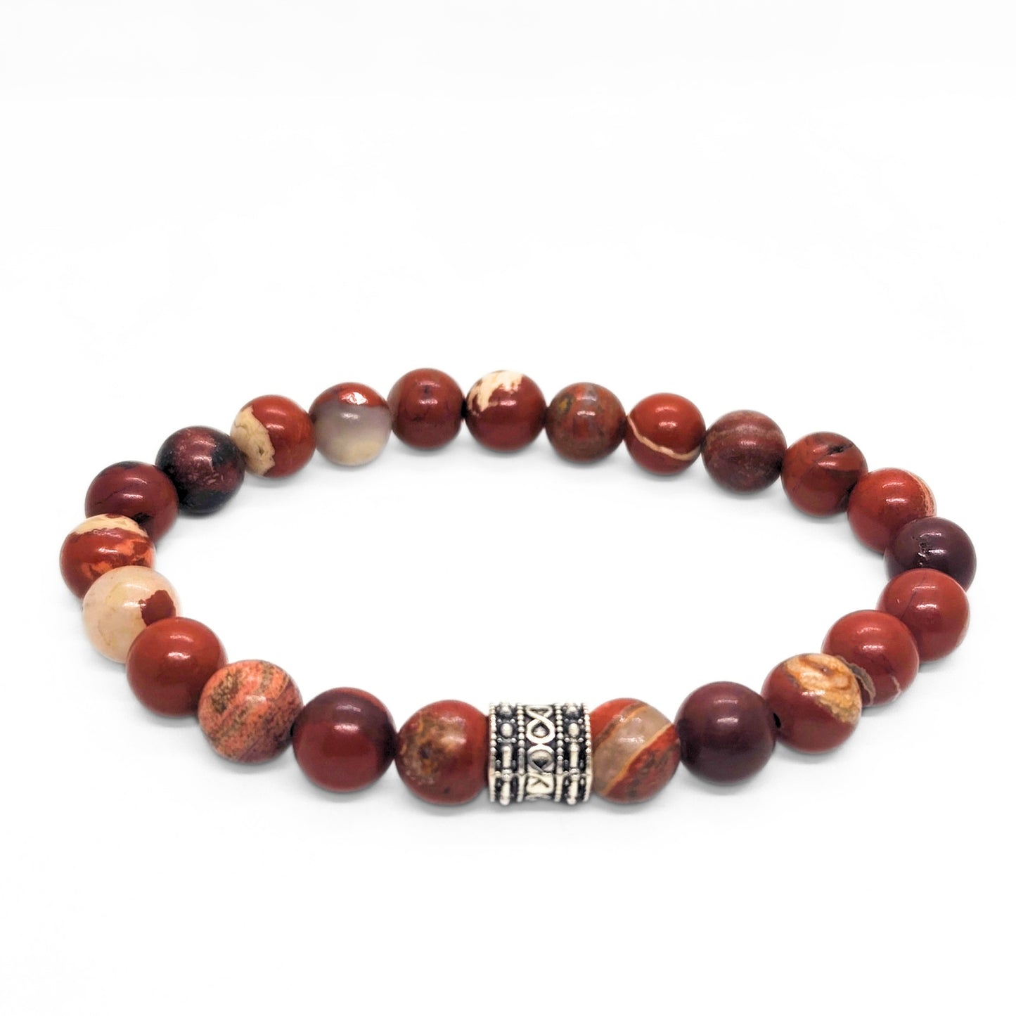 Red jasper stone bracelet with round beads and silver-tone center clasp, plus light beige accents