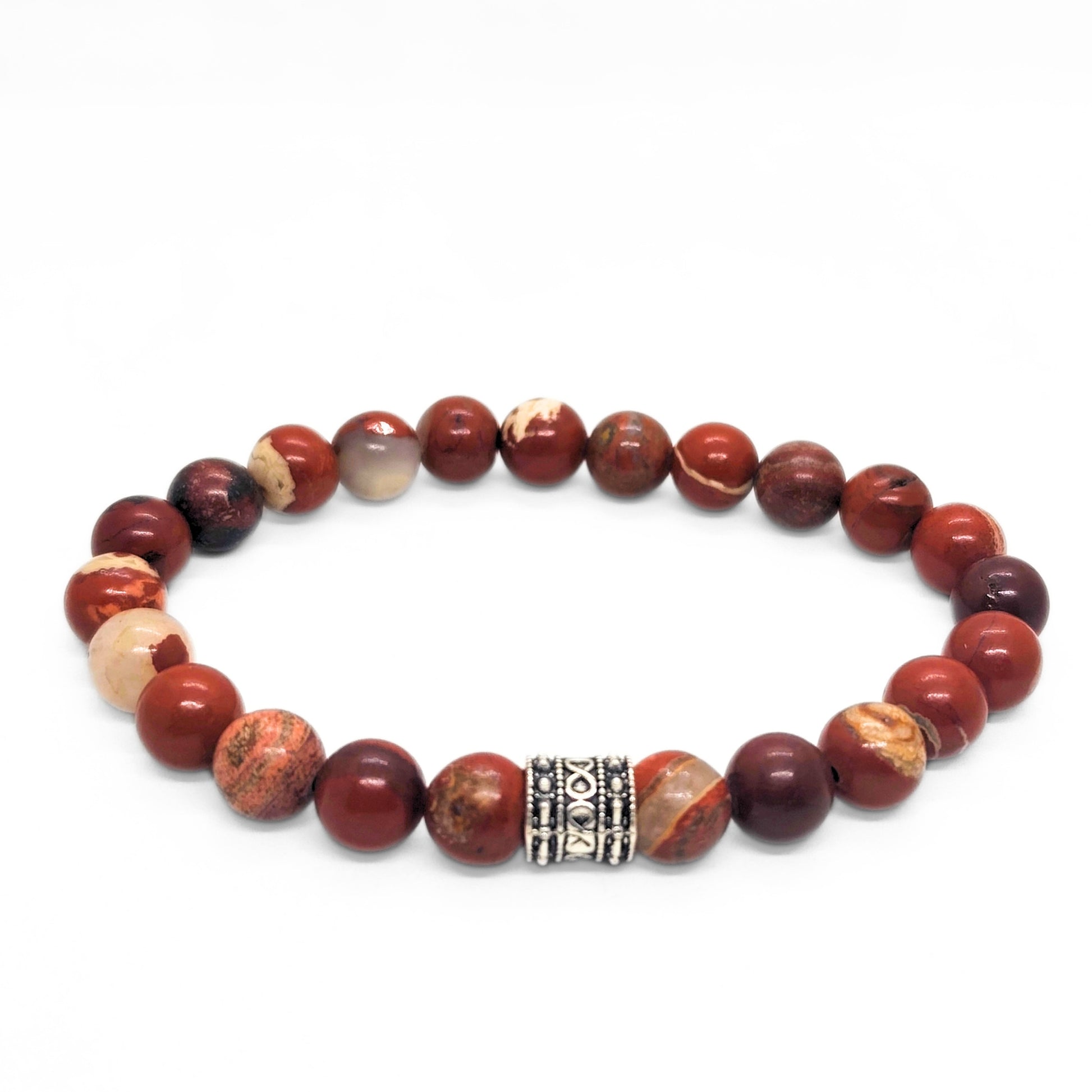 Red jasper stone bracelet with round beads and silver-tone center clasp, plus light beige accents