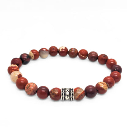 Red jasper stone bracelet with round beads and silver-tone center clasp, plus light beige accents