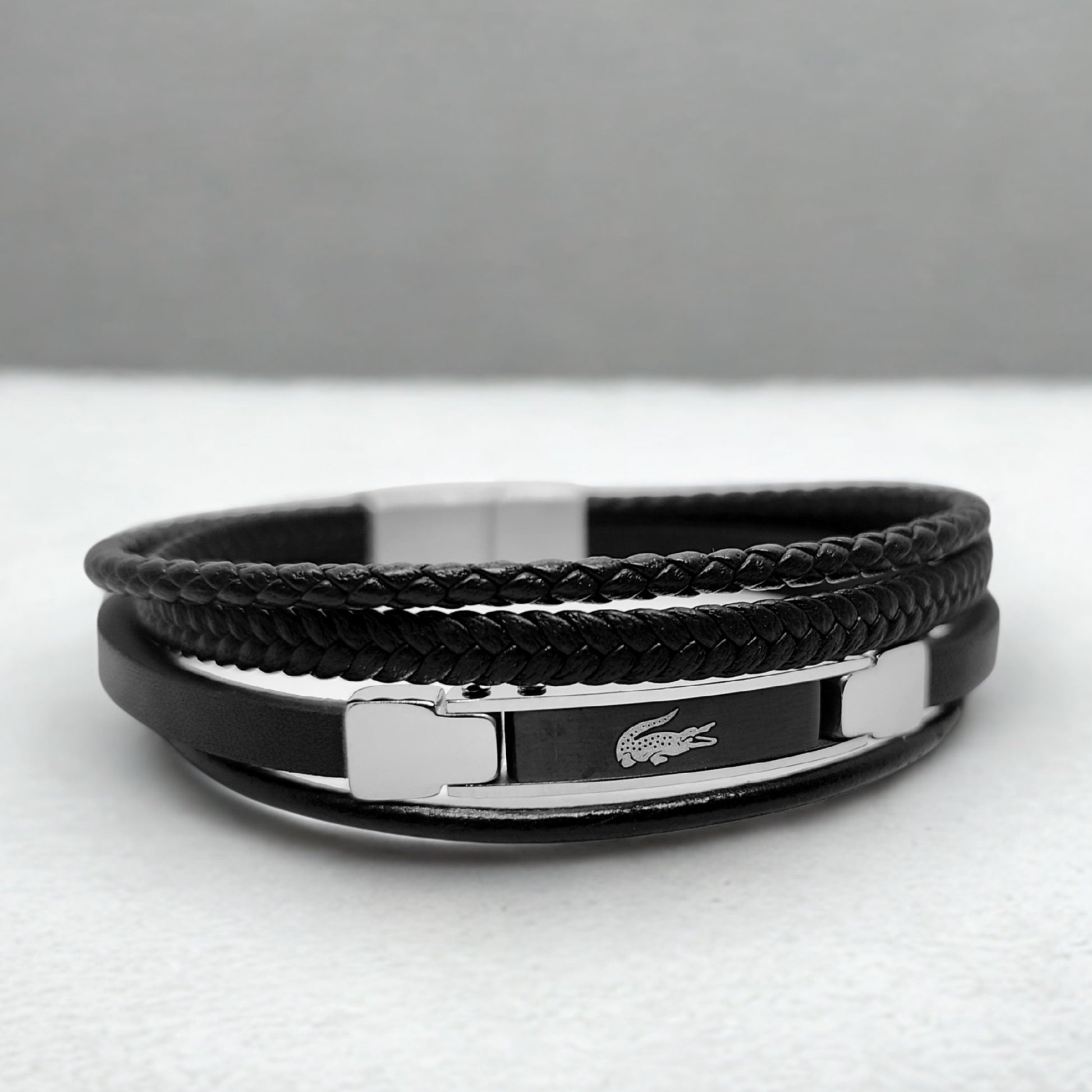 Premium Black Leather B-152 Bracelet from Overpowered Accessories featuring braided and smooth leather with a metallic clasp.