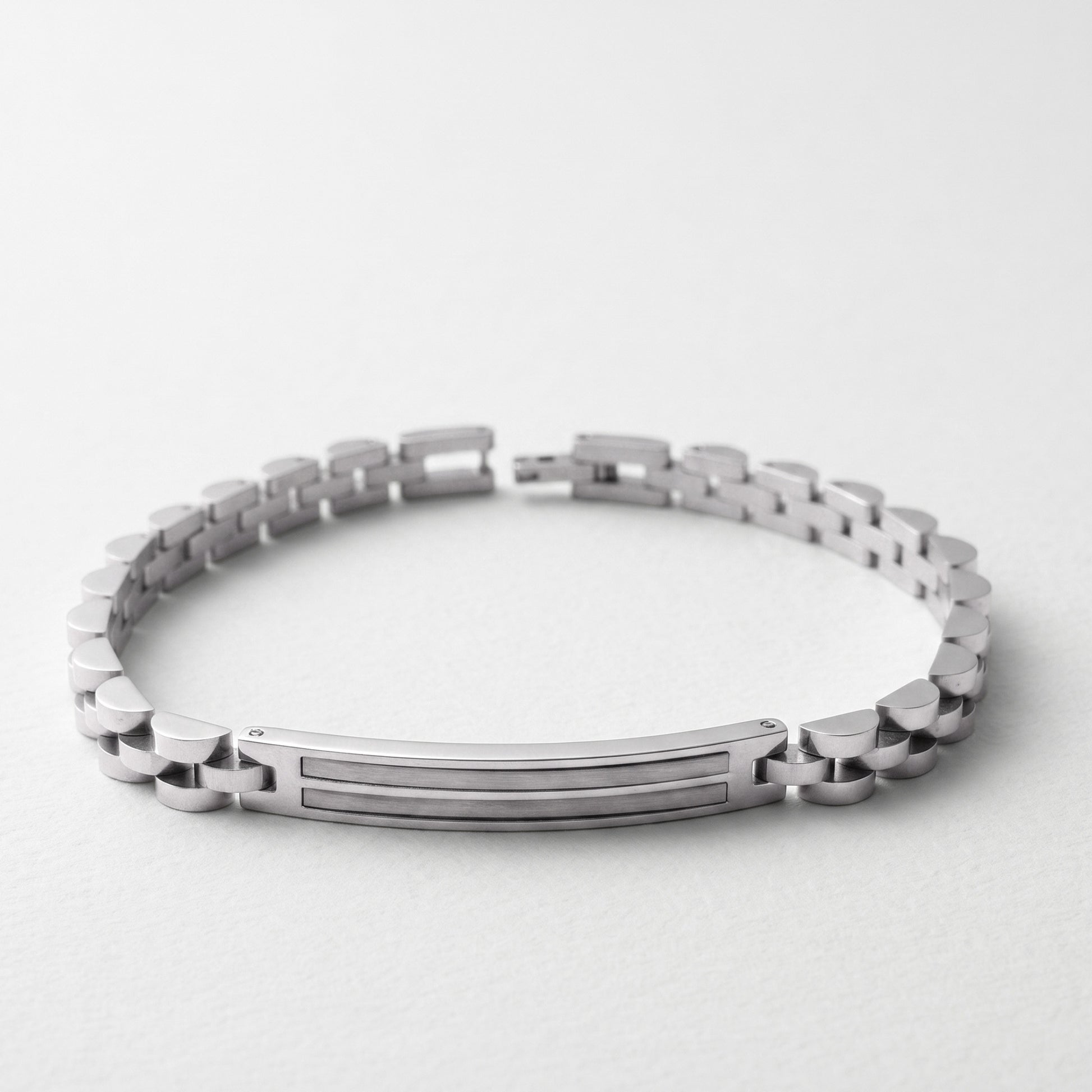 Silver stainless steel bracelet with hinged clasp and horizontal bar center detail