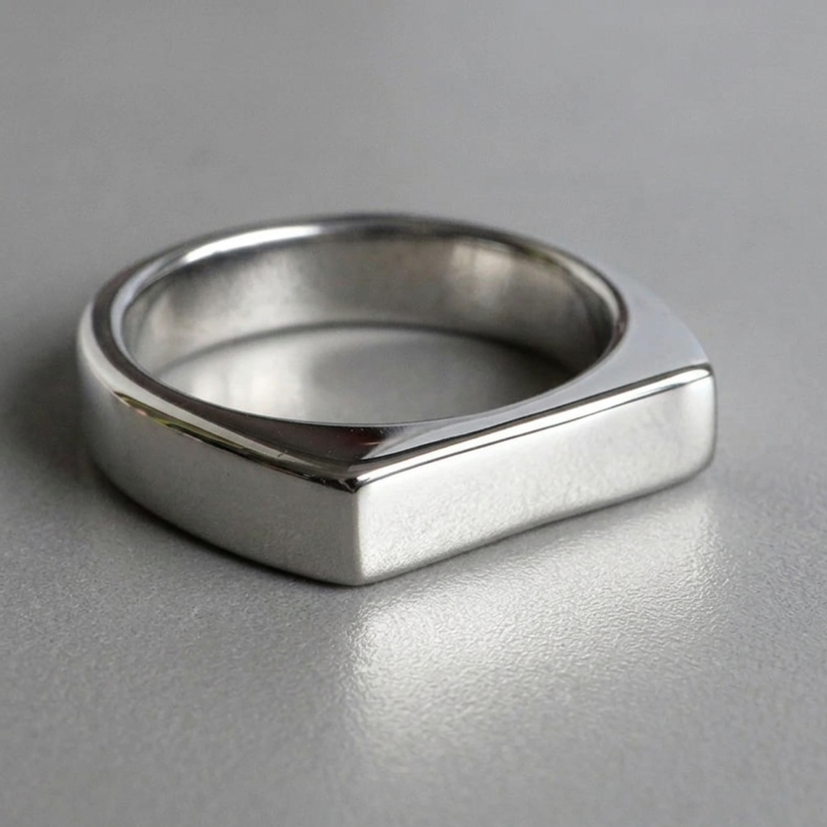 R-9 polished steel signet ring, flat rectangular top close-up