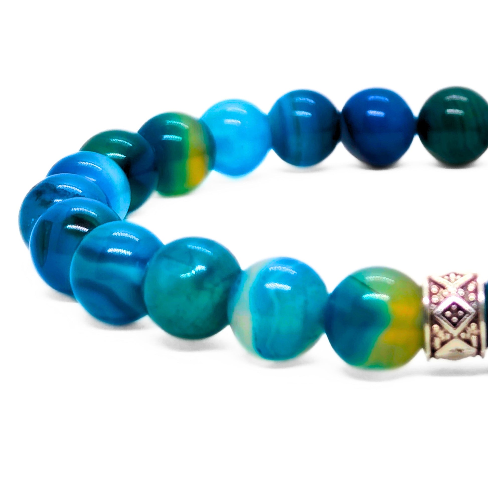 Agate bead bracelet close-up: blue and teal round beads with silver diamond centerpiece