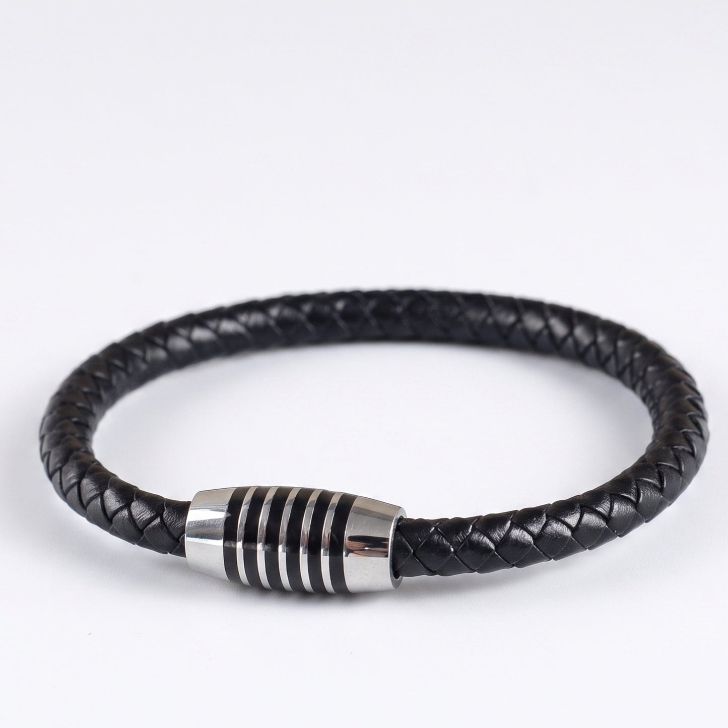 Black braided leather bracelet with silver-tone ringed clasp, side angle