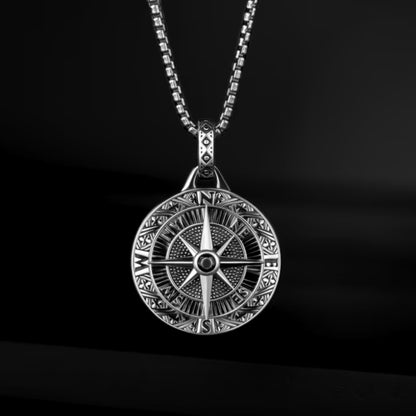 Silver compass pendant necklace with intricate detailing, featuring a micro-zircon stone, on a chain. Ideal for men.