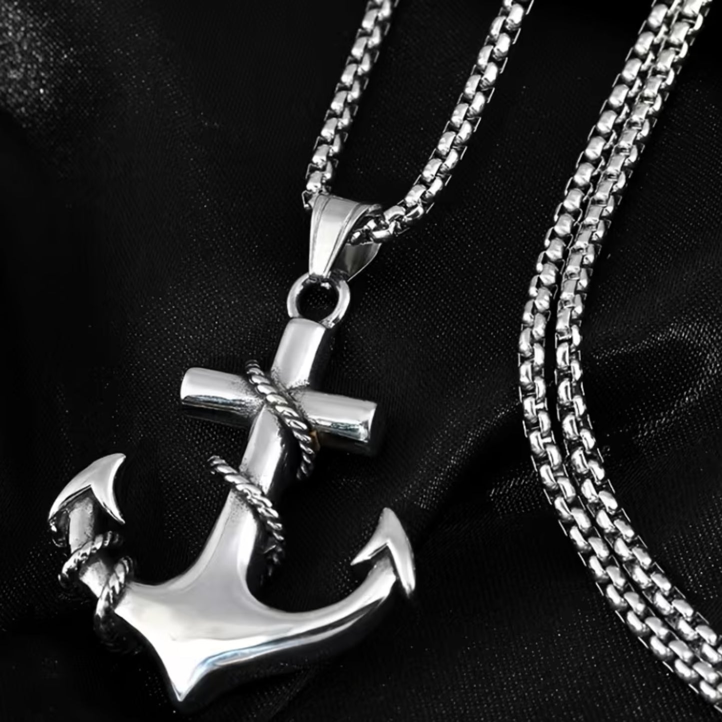 Silver anchor pendant necklace with a twisted rope design, featuring a sturdy chain, ideal for men's fashion.