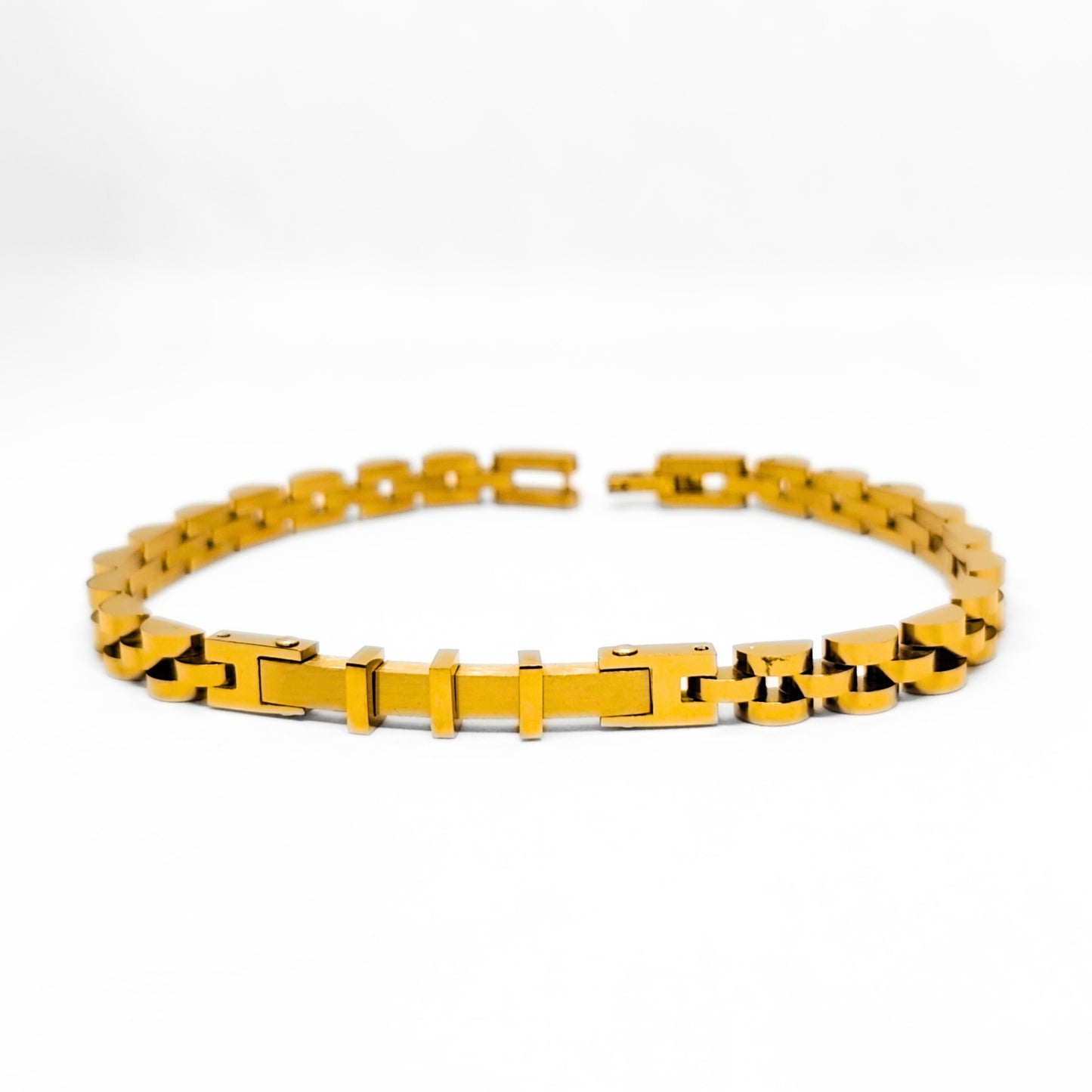 Gold stainless steel bracelet with repeating bar-and-chain links and box clasp