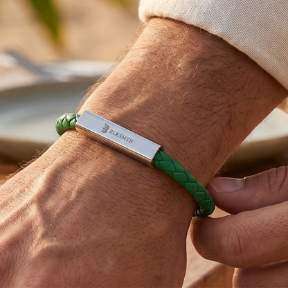 Green braided leather bracelet with silver rectangular clasp, worn on forearm