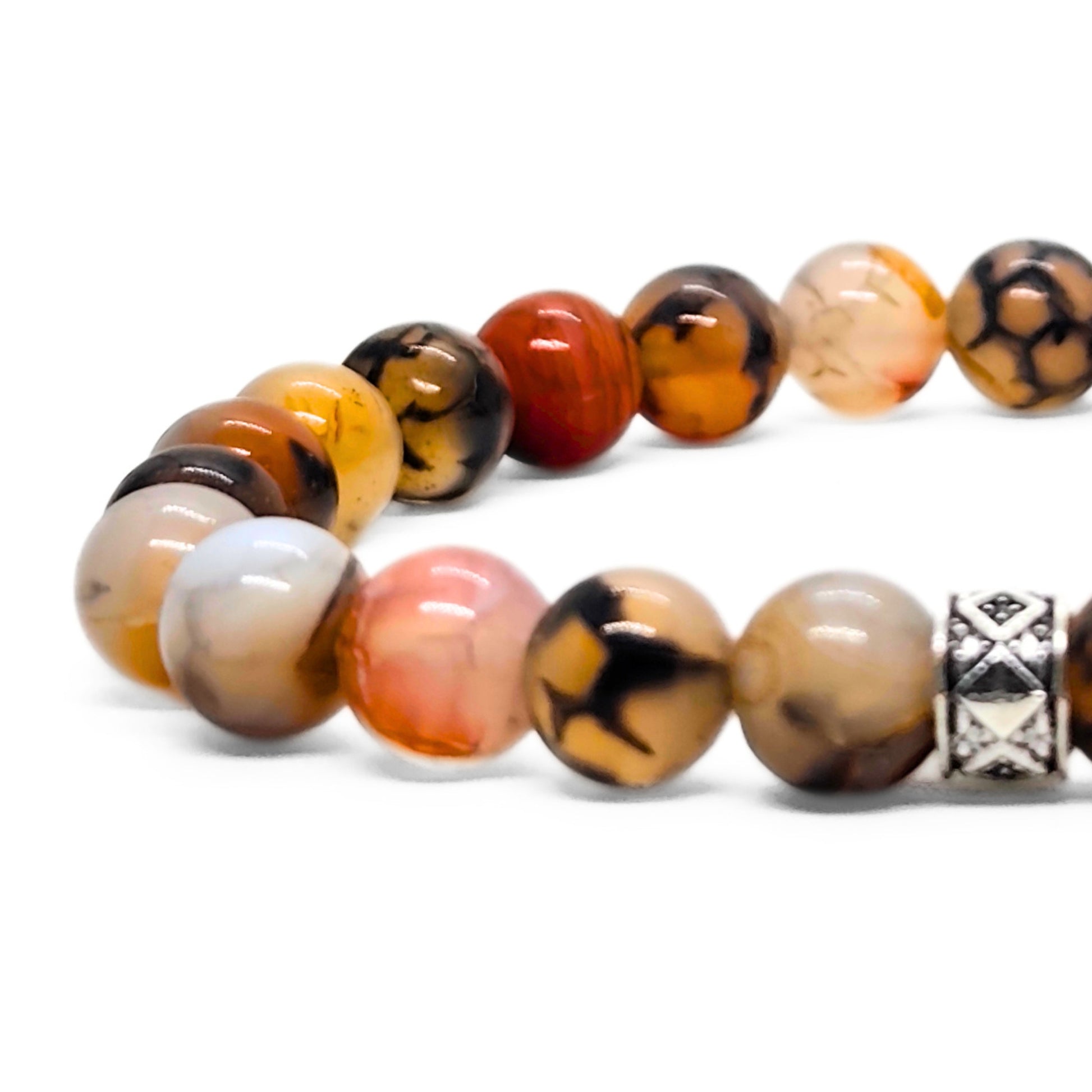 Natural agate beaded bracelet close-up with multicolor stones and a silver geometric charm